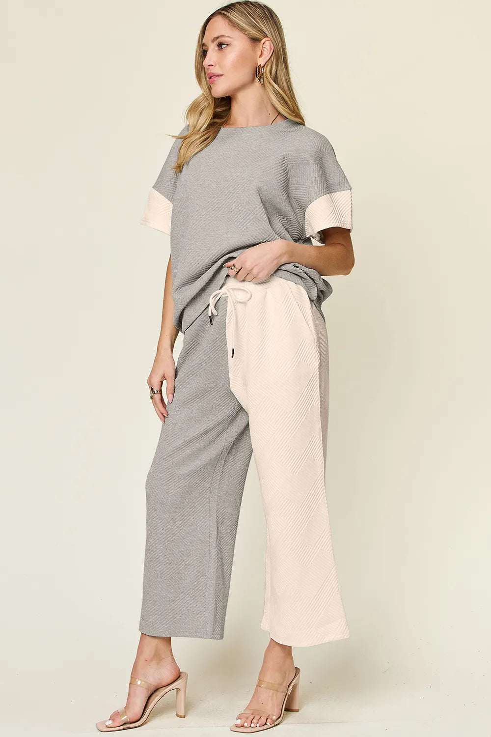 Neckline detail of the texture contrast tee