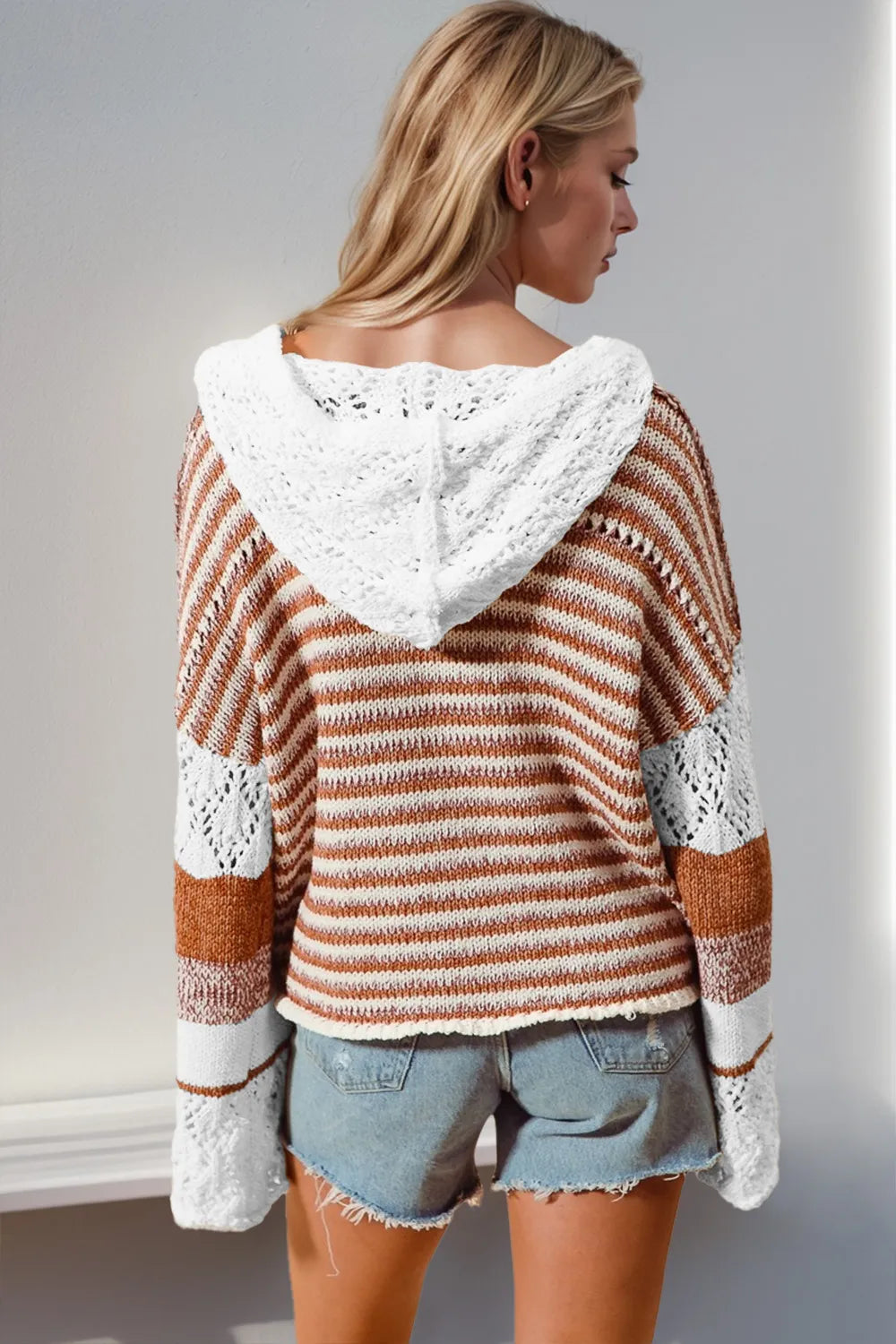Detail of openwork knit and hood on sweater