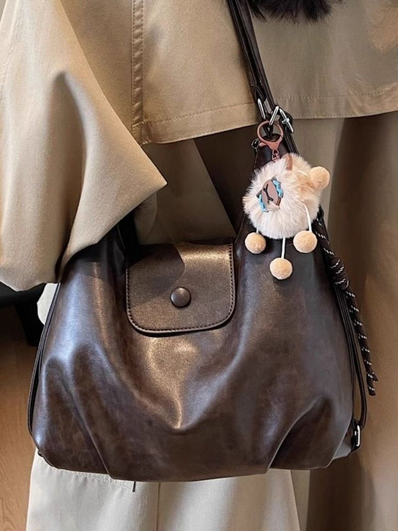 Coffee brown faux leather adjustable strap shoulder bag front view