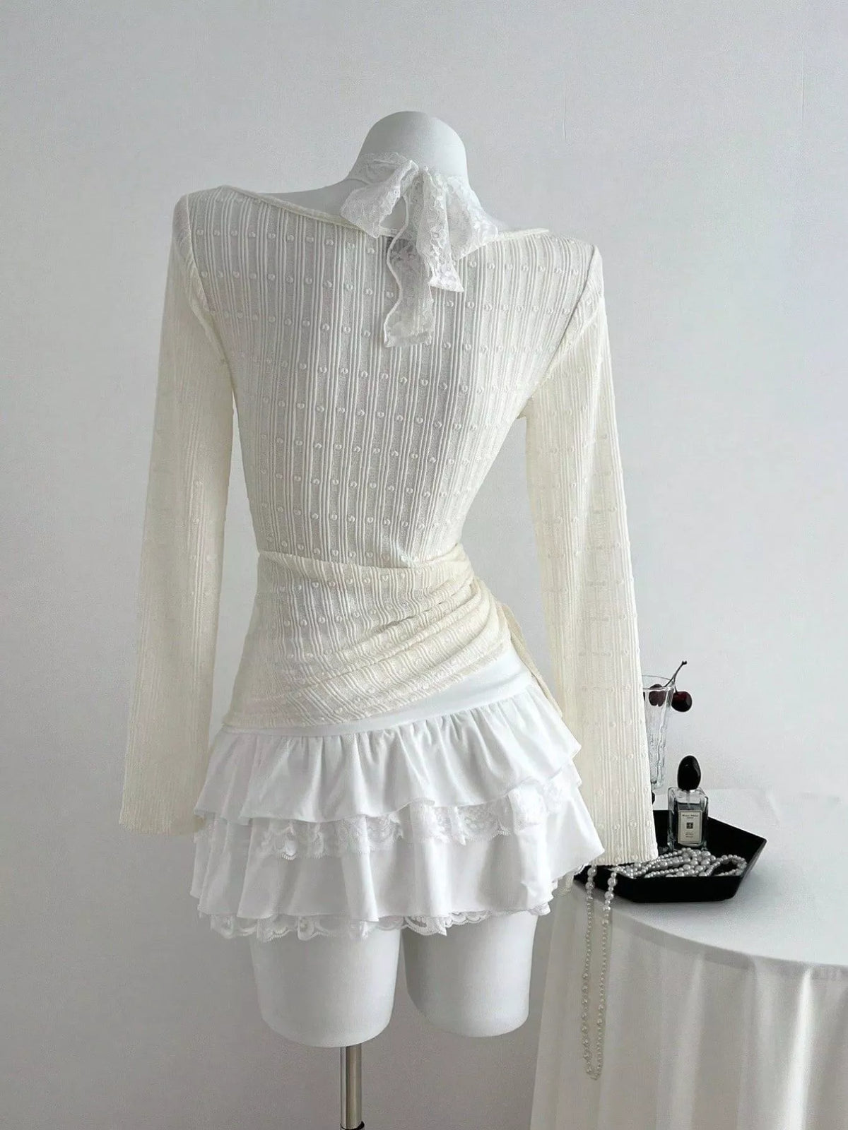 Front view of the V neck bow detail top