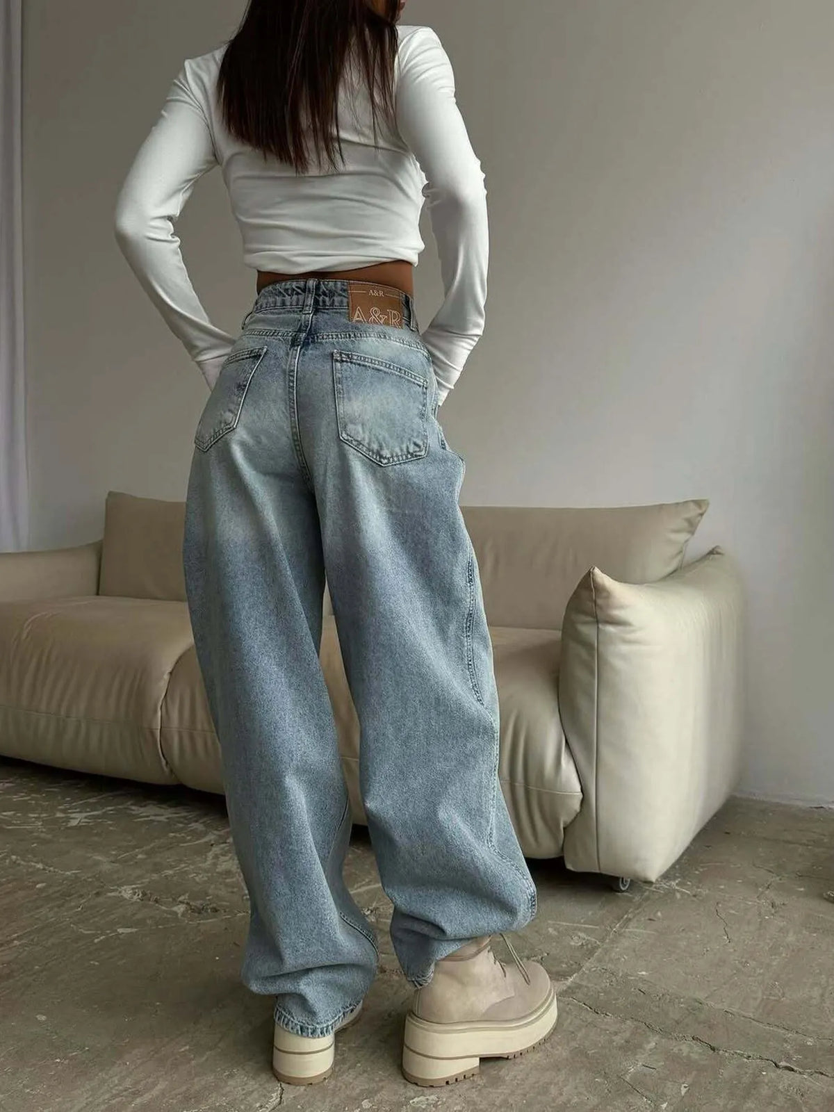Side view of flowing wide leg jeans