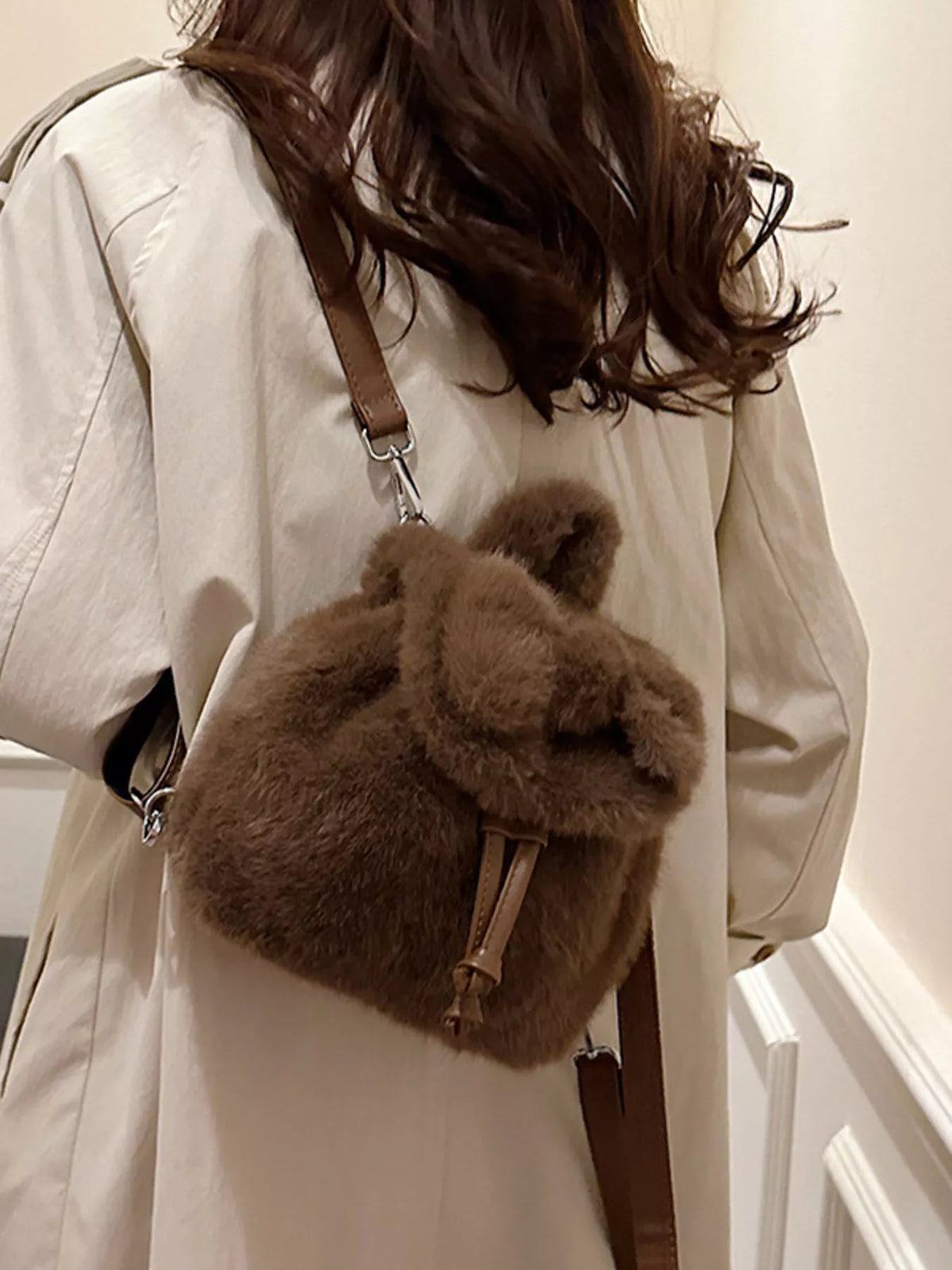 Soft plush backpack held in hand
