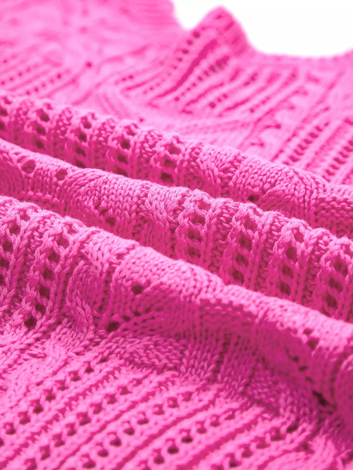 Vibrant fuchsia sweater vest styled casually
