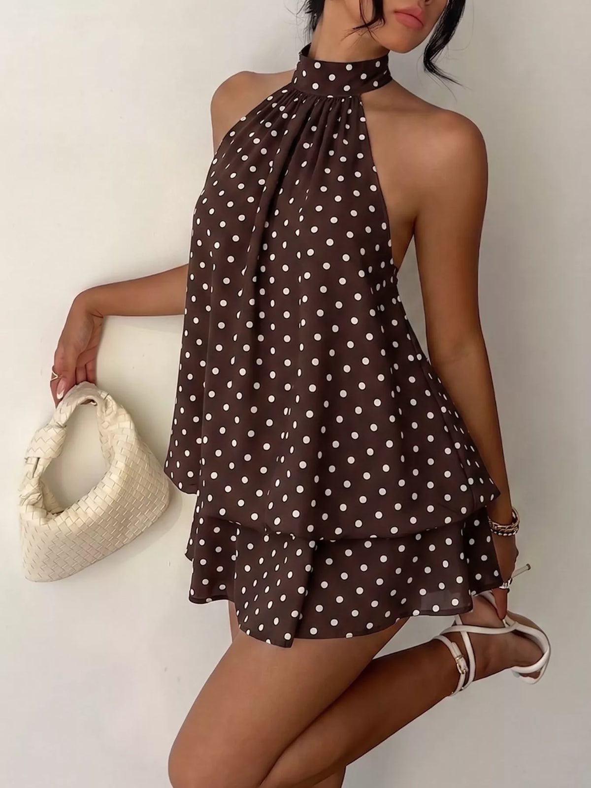 Polka dot halter dress on model outdoors