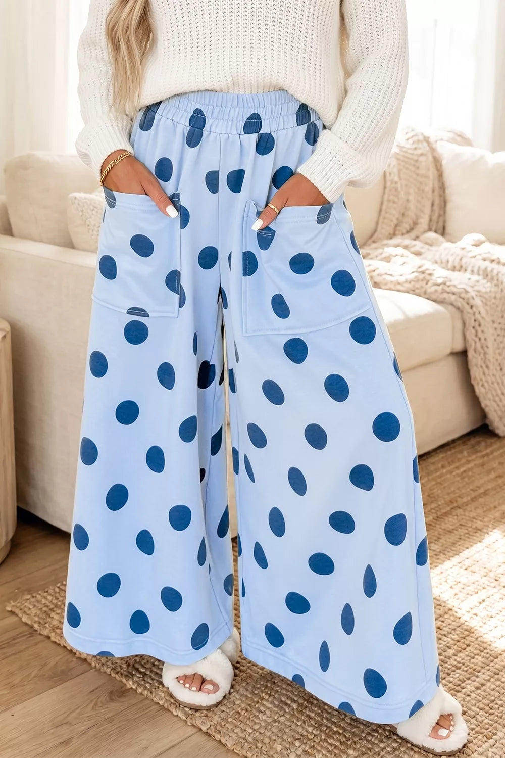 Side view of the polka dot pants showing the wide leg hem