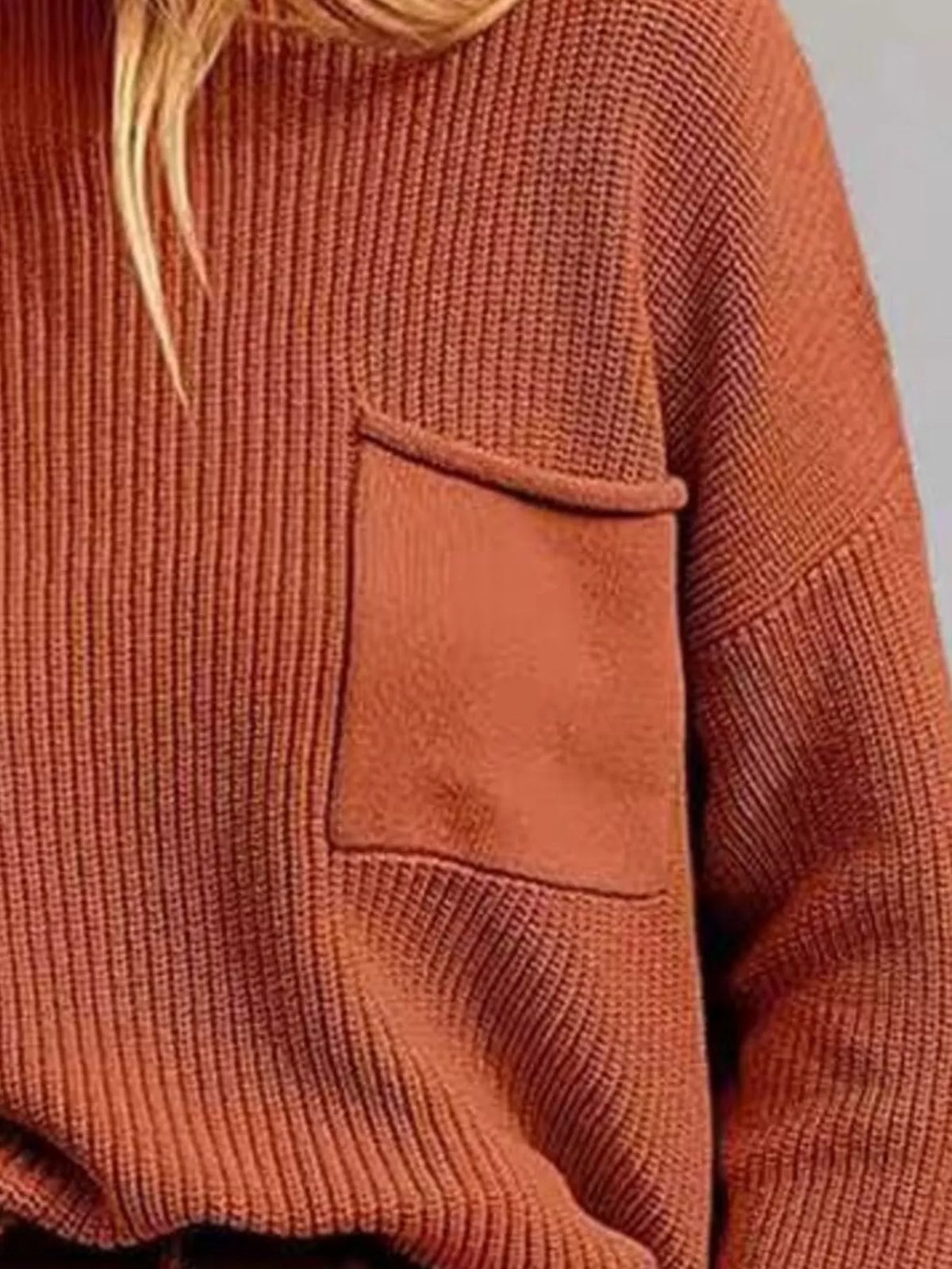 pocket detail dropped shoulder ribbed sweater texture close up
