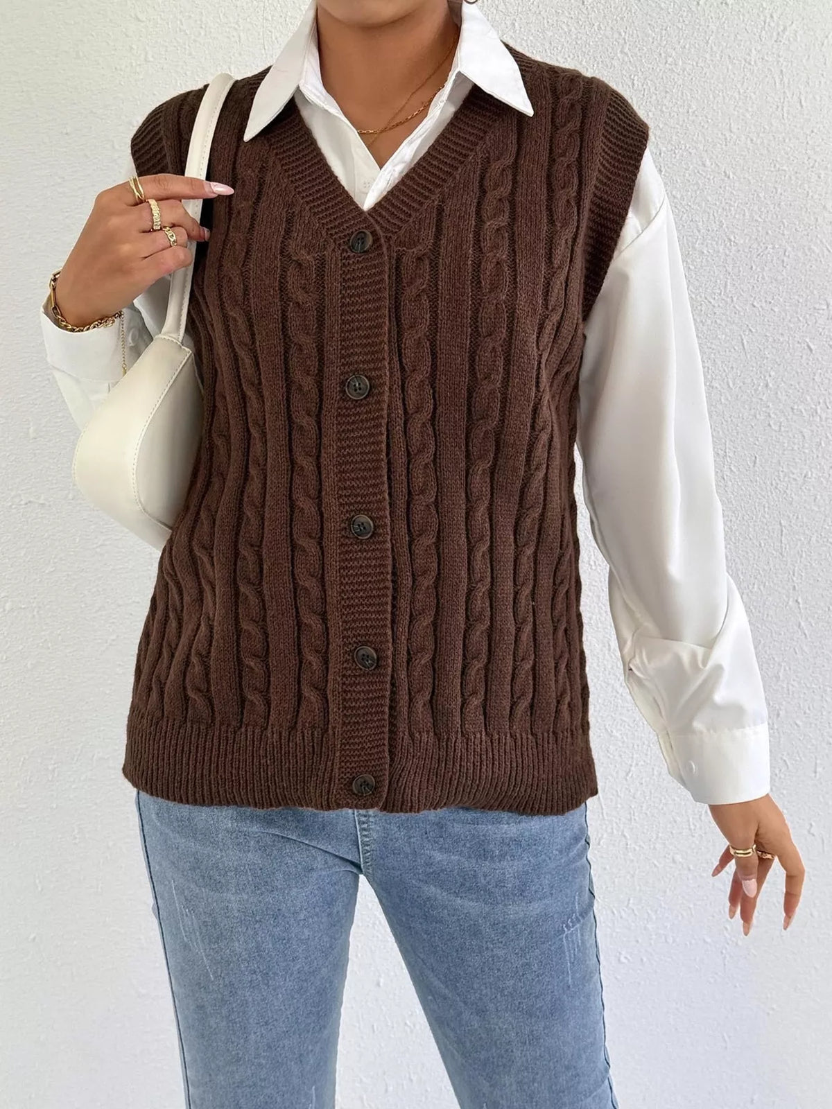 Cable knit button up sweater vest styled front view