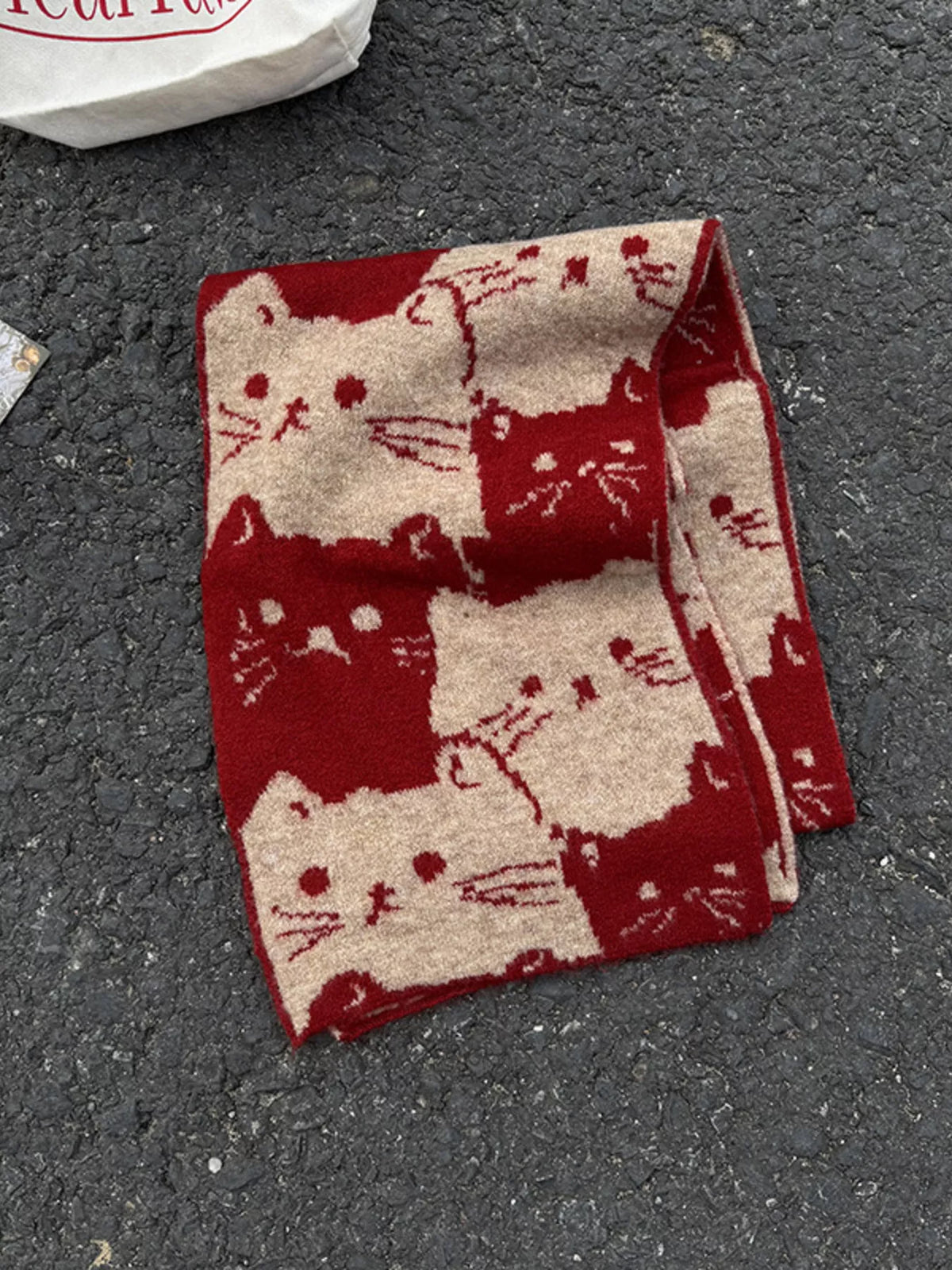 Soft cat motif scarf close up