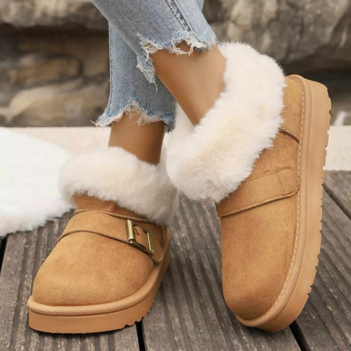 fuzzy trim buckle winter boots worn with denim
