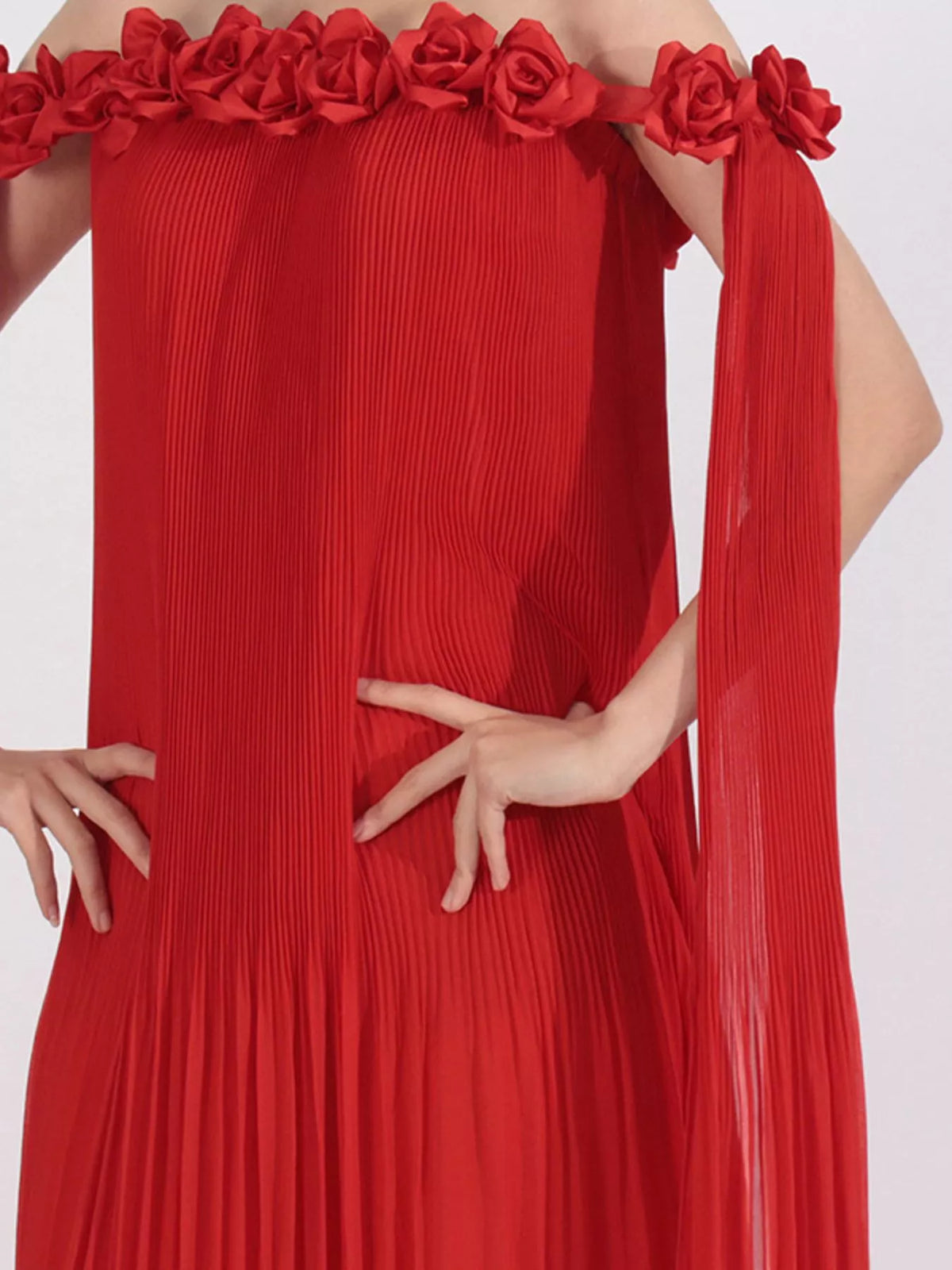 off shoulder floral pleated maxi dress seated pose