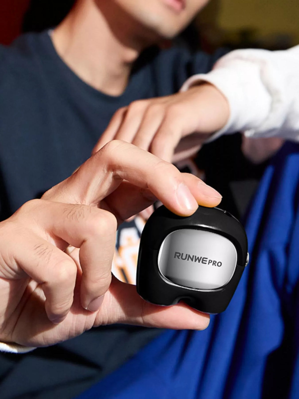 Portable shaver held in hand