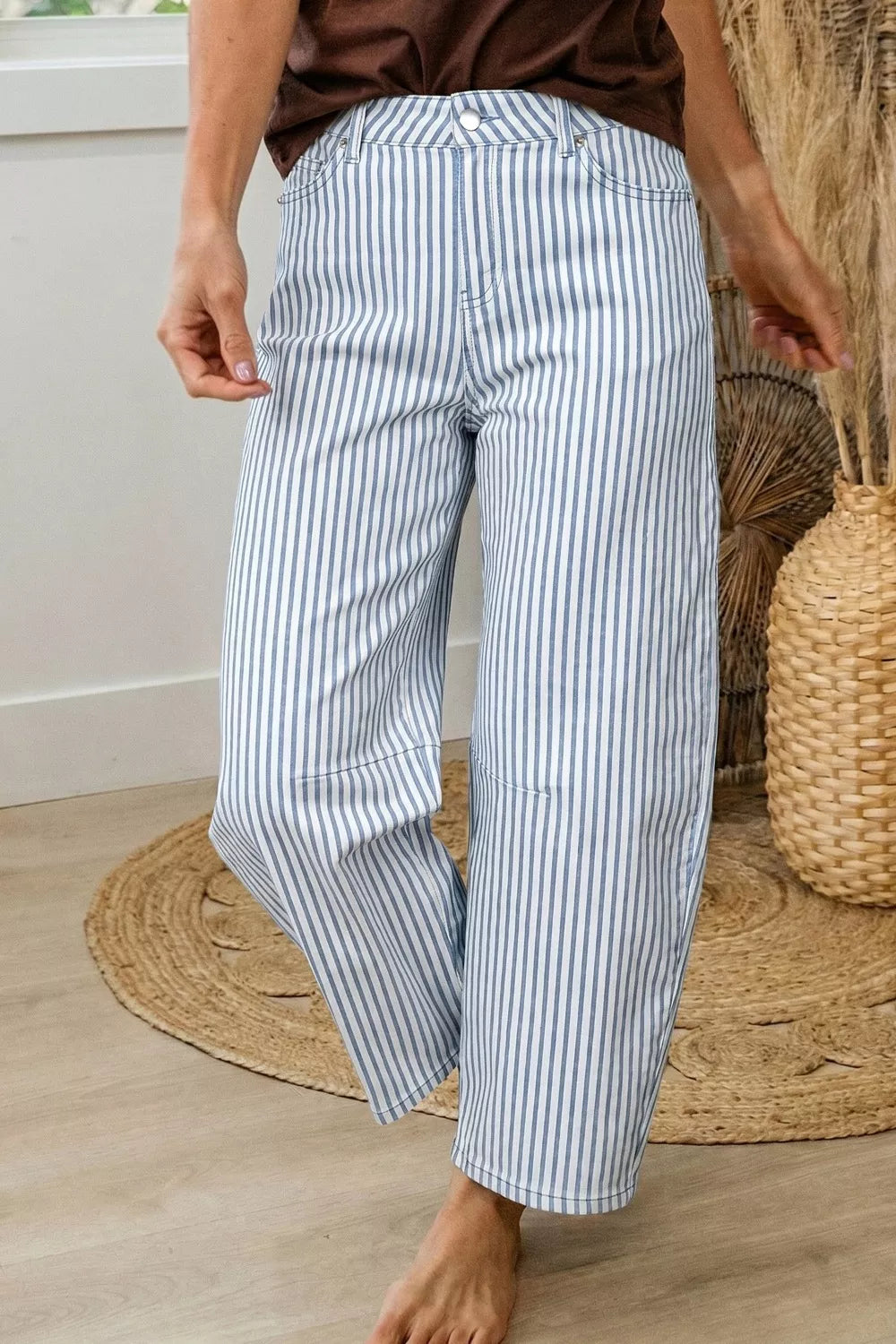 Barrel leg jeans showing curved sculptural silhouette