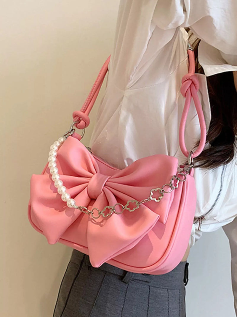 Bowknot pearl chain shoulder bag in pink front view