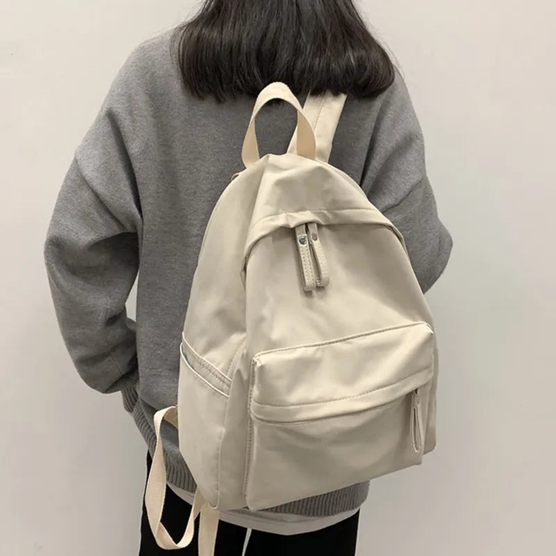 Cotton zip top backpack flat lay