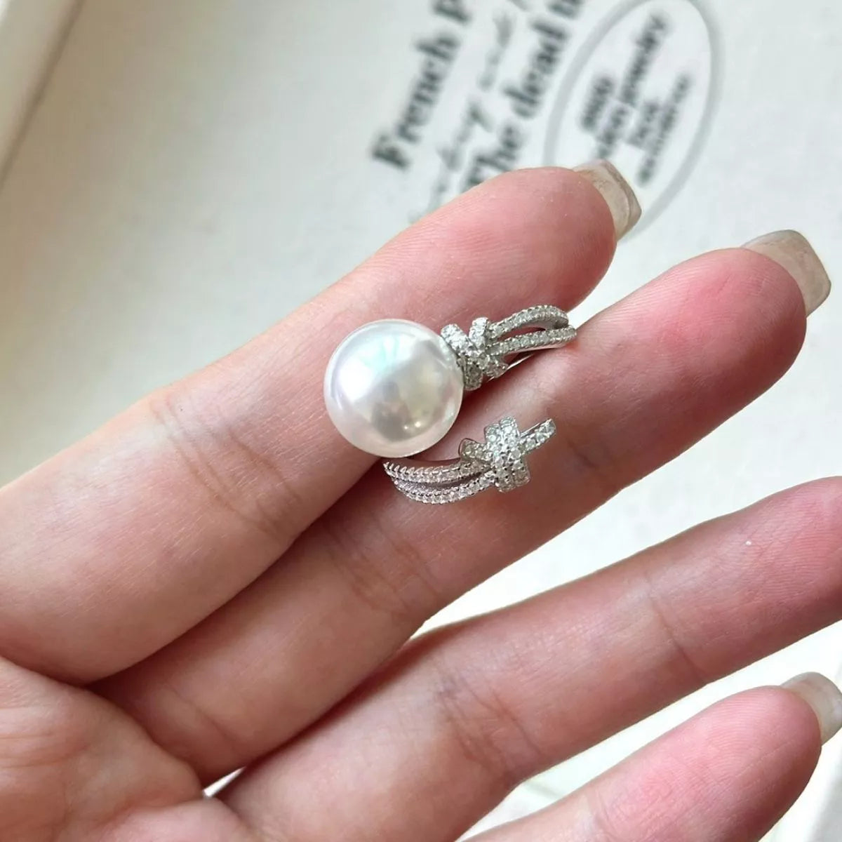 pearl and zircon bypass ring in sterling silver model styling