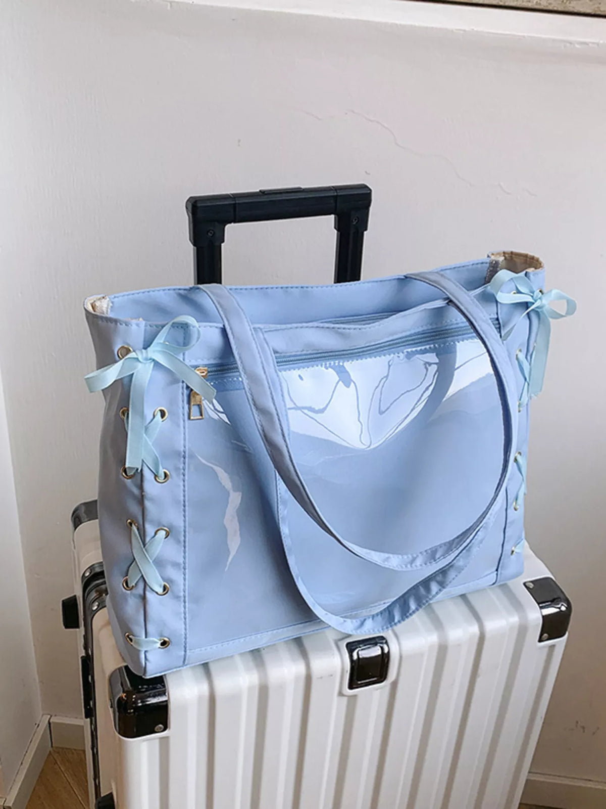 Lace up clear shoulder bag detail view