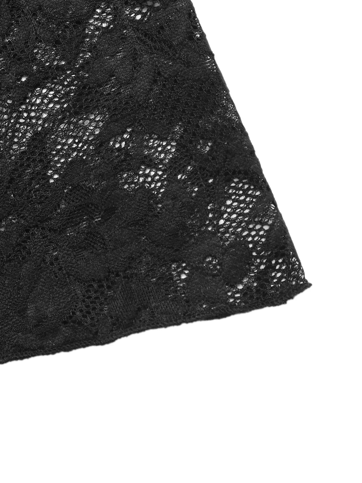 Seated styling shot of the black lace dress