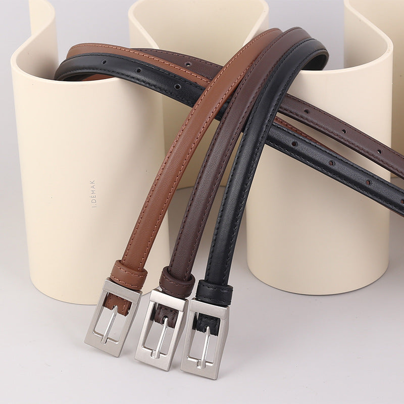 Metal buckle leather belt full length view