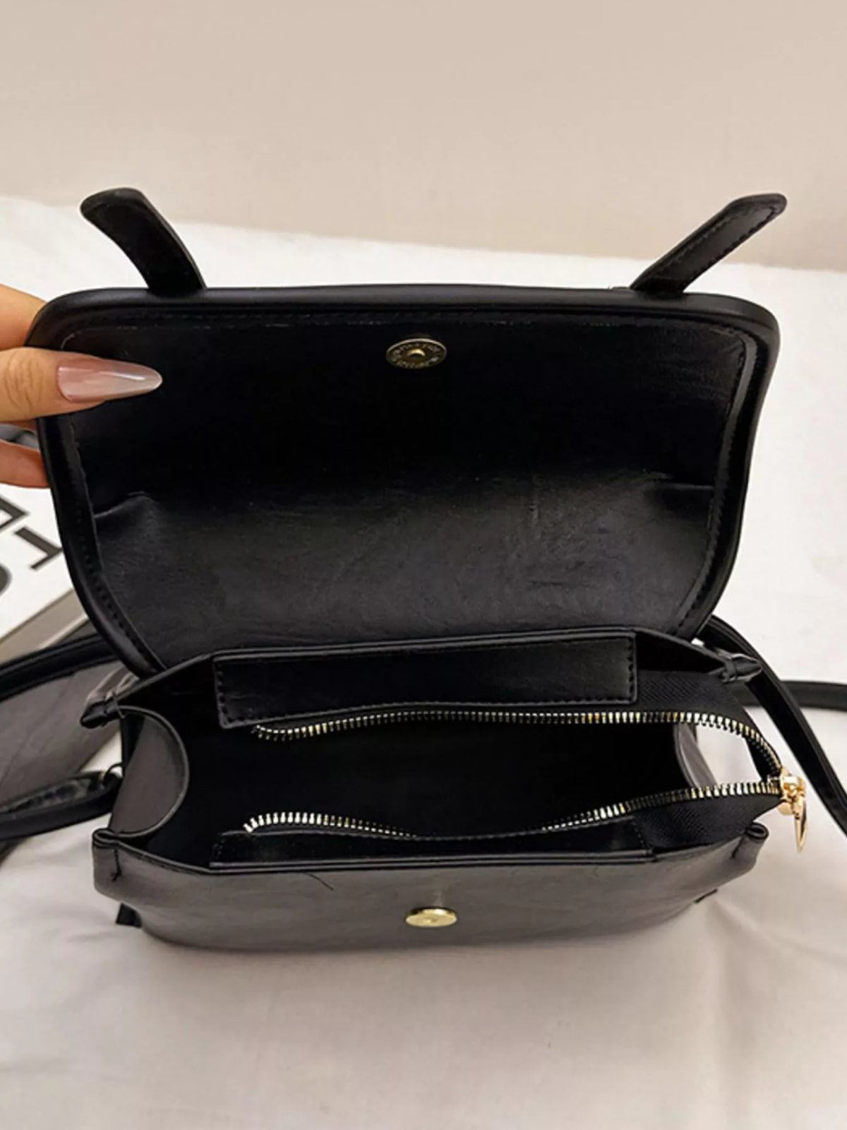 Leather backpack worn over shoulder