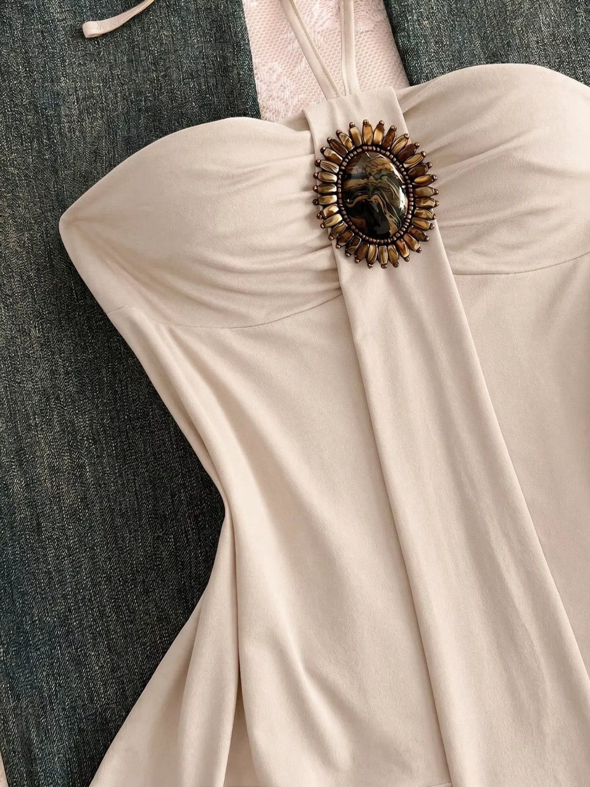 Front view of the halter neck cami with embellished detail