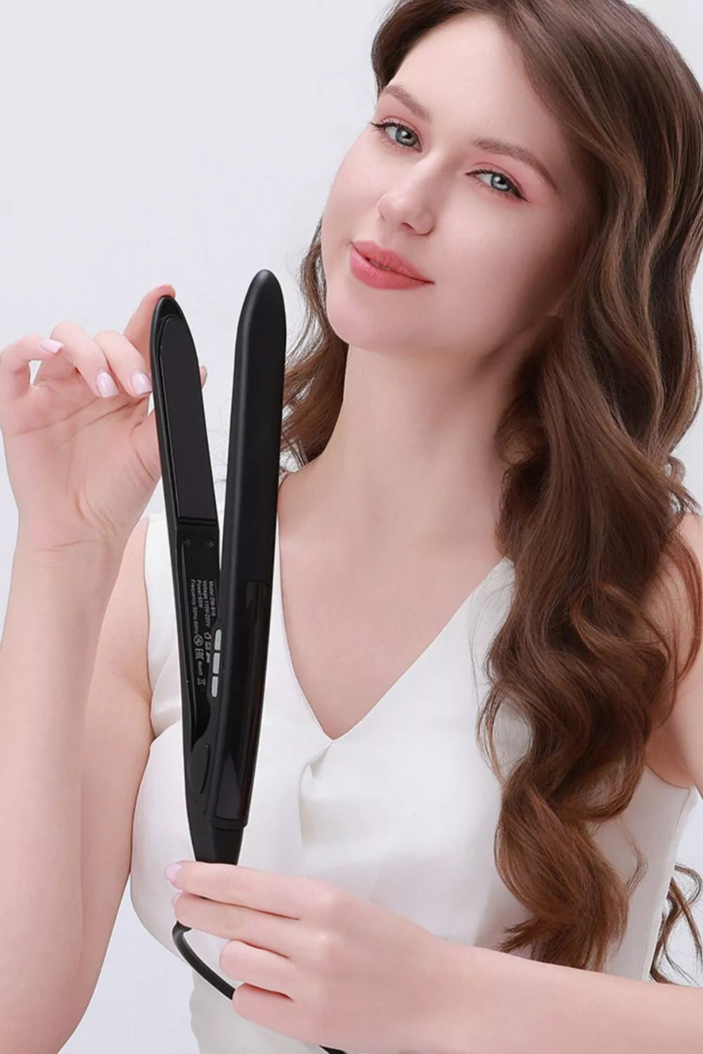 Styling iron used to straighten hair