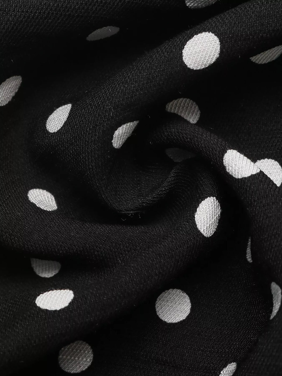 Black polka dot spaghetti strap ruffle hem dress front view