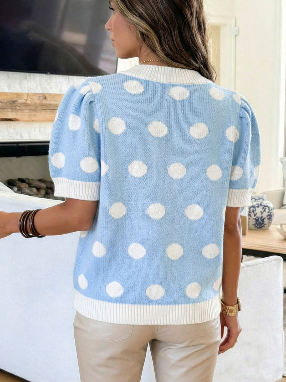 Blue polka dot knit sweater side view