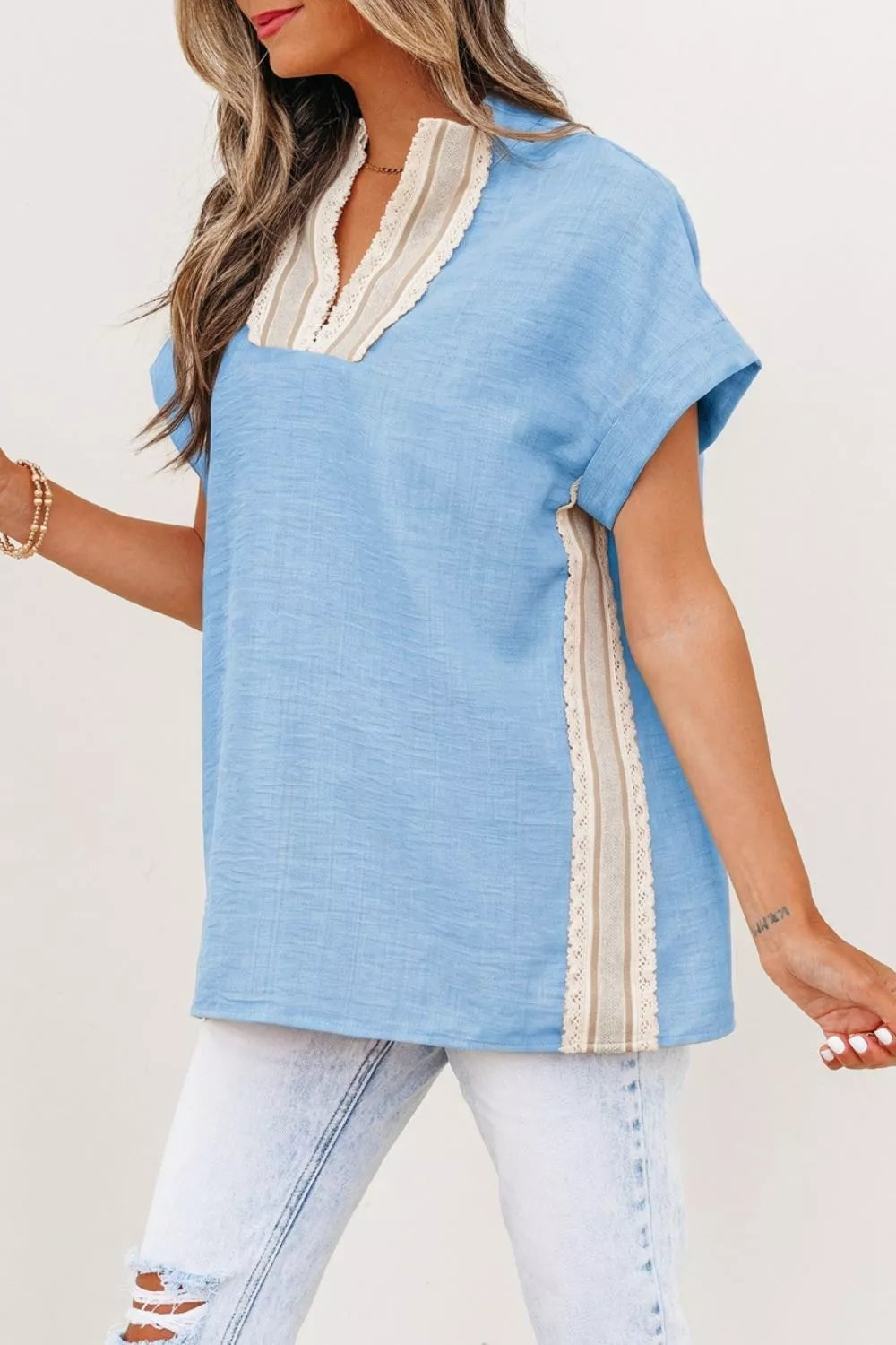 Light blue crochet lace short sleeve blouse detail view