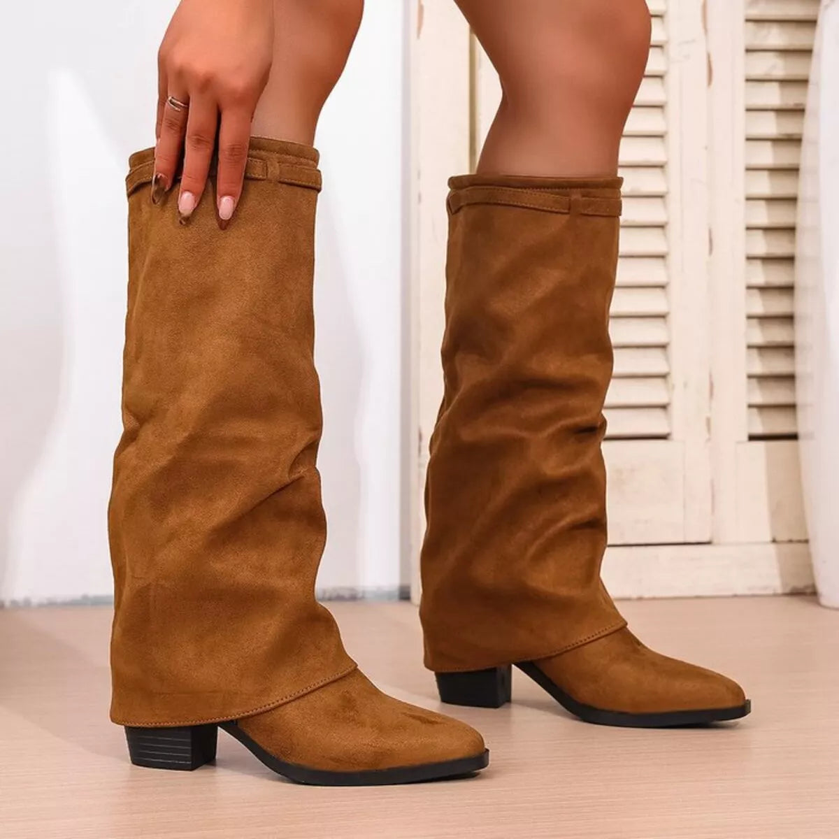 Point toe block heel boots standing pair