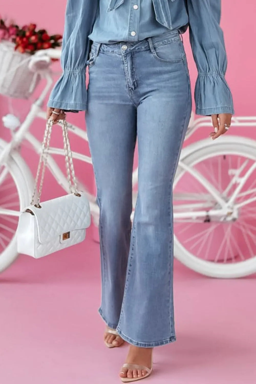Blue bootcut jeans with pockets side view