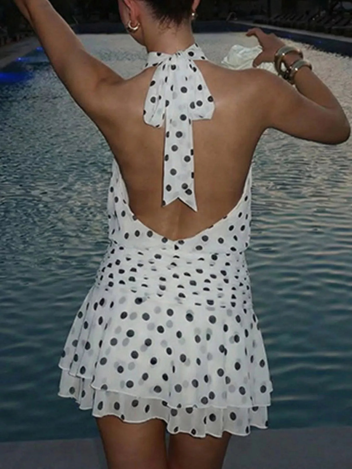 White polka dot dress styled with sandals