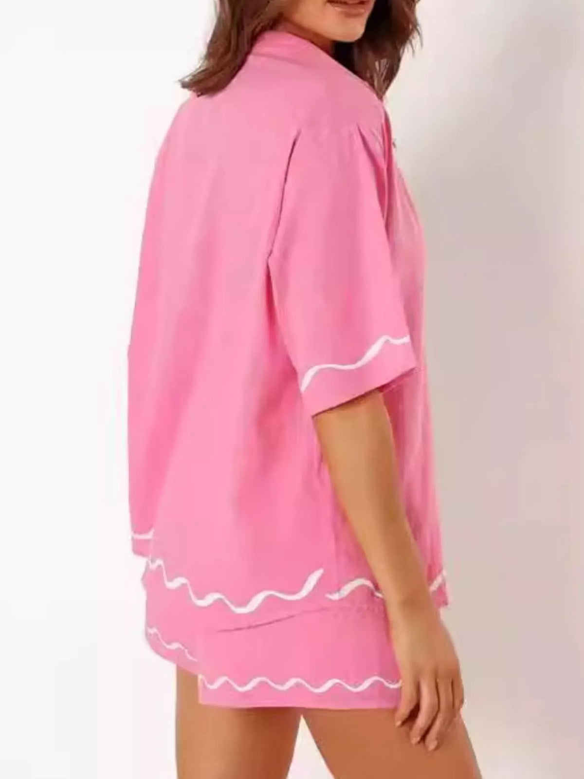 Coordinated pink shorts detail on model