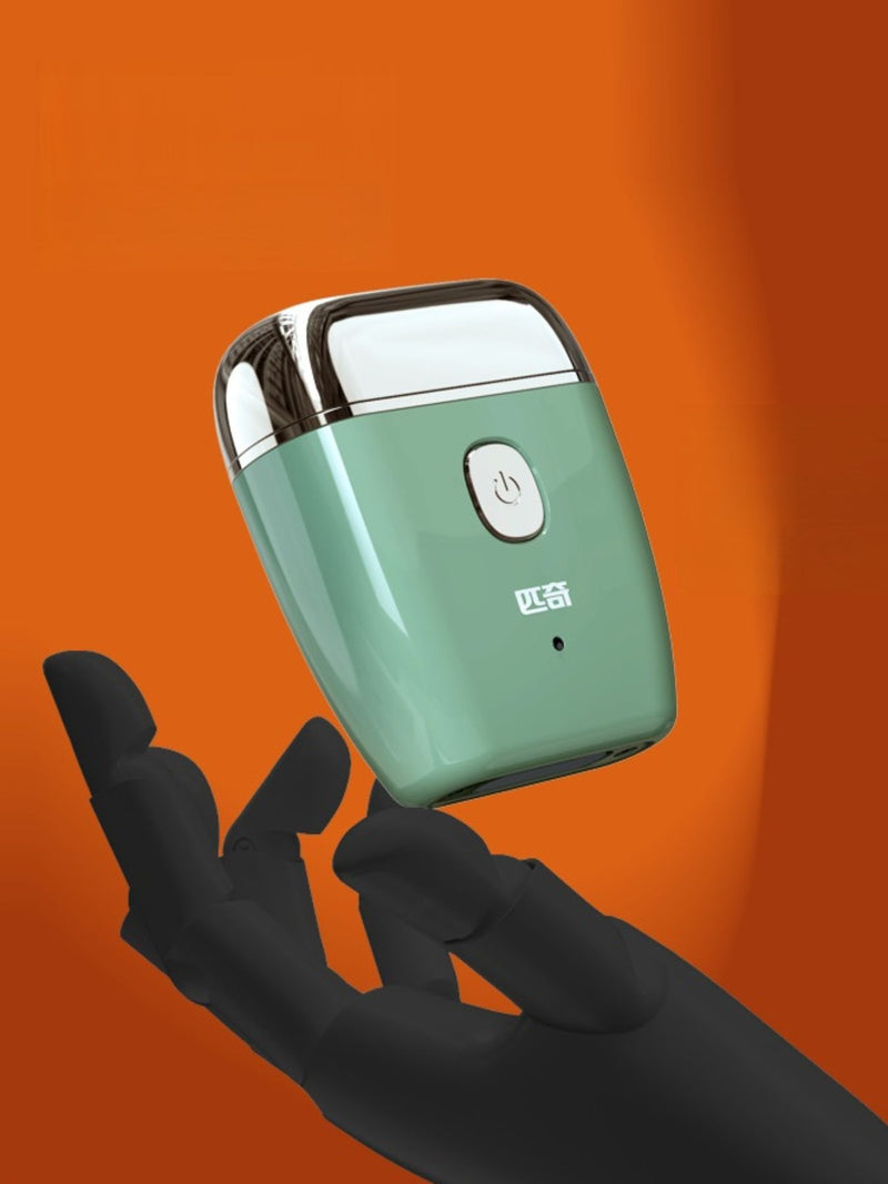 Portable mini electric shaver in green