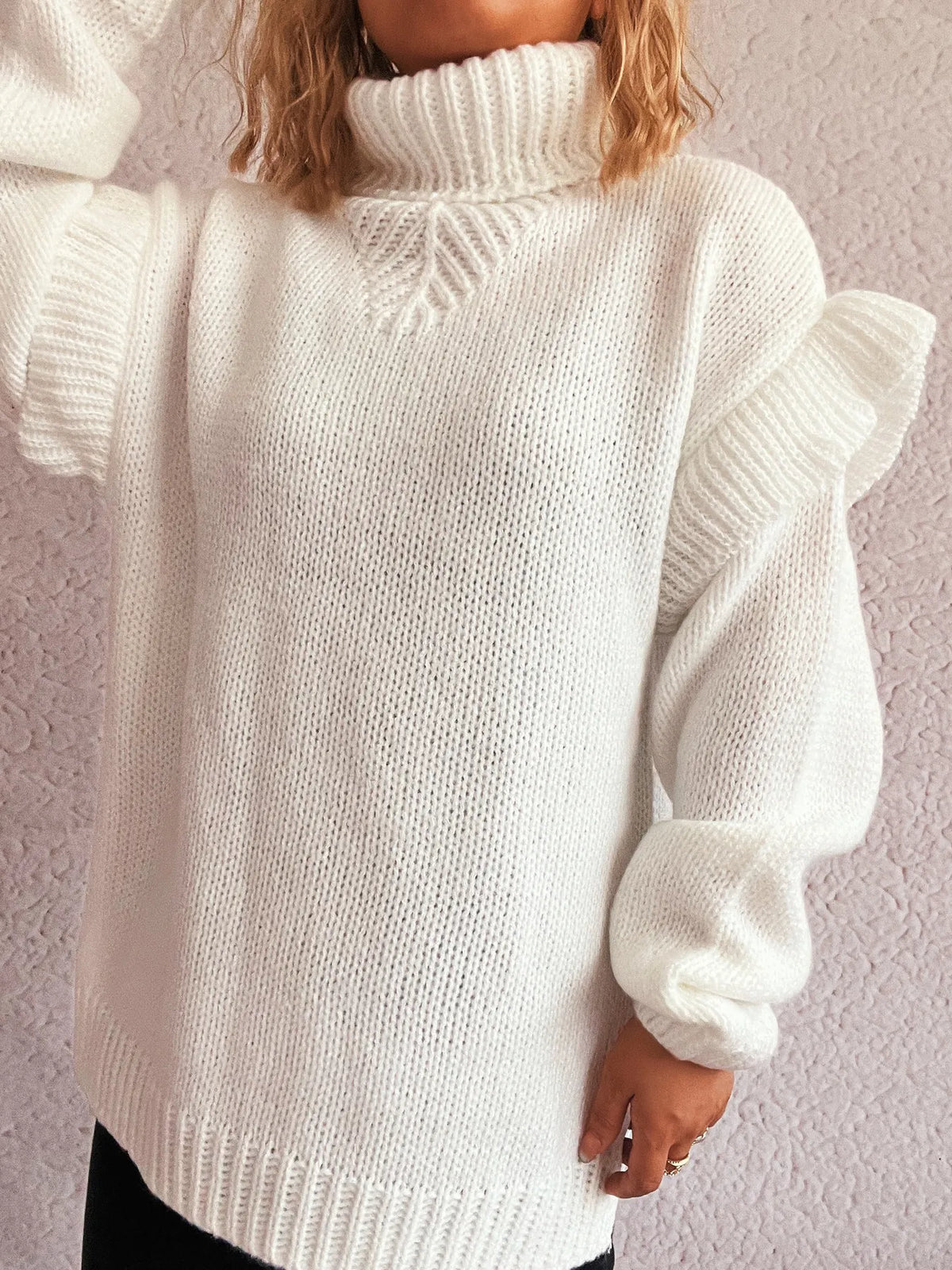Ruffled turtleneck long sleeve sweater on model