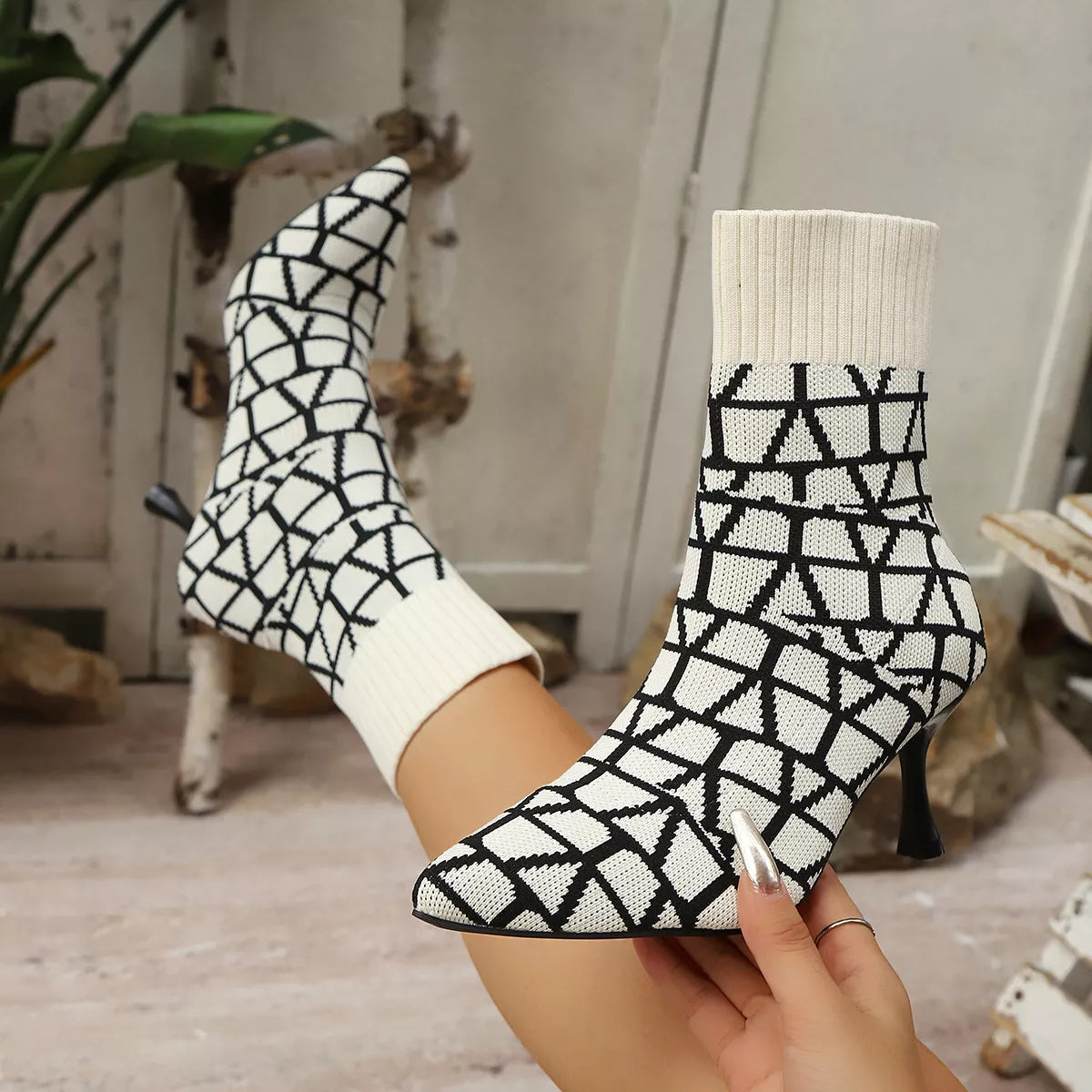 Black point toe flared heel boots upper texture detail