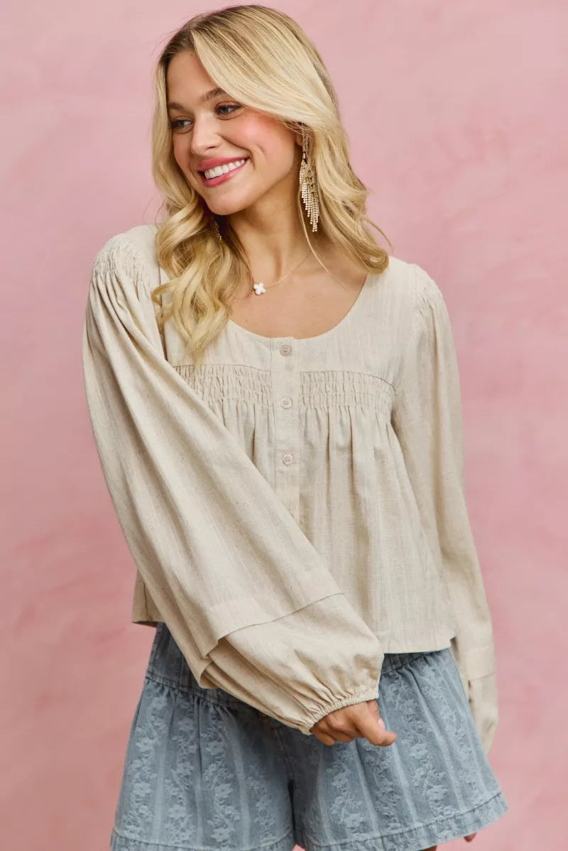 Cream linen blend smocked long sleeve top, back view
