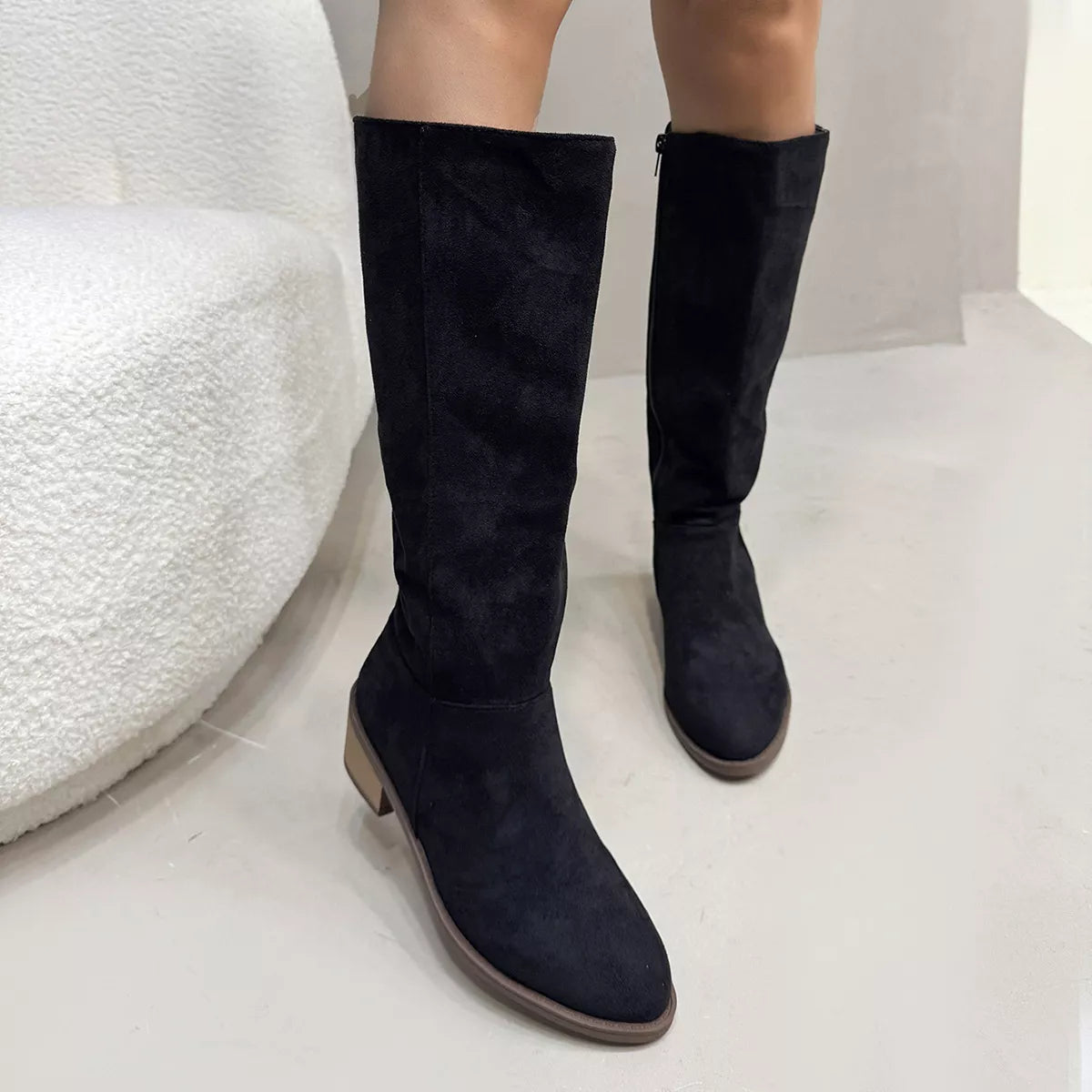 Black round toe block heels boots side profile view