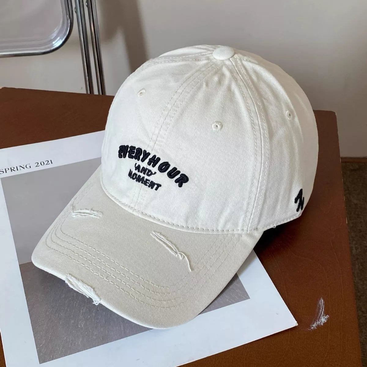 Distressed edge detail along the cap brim