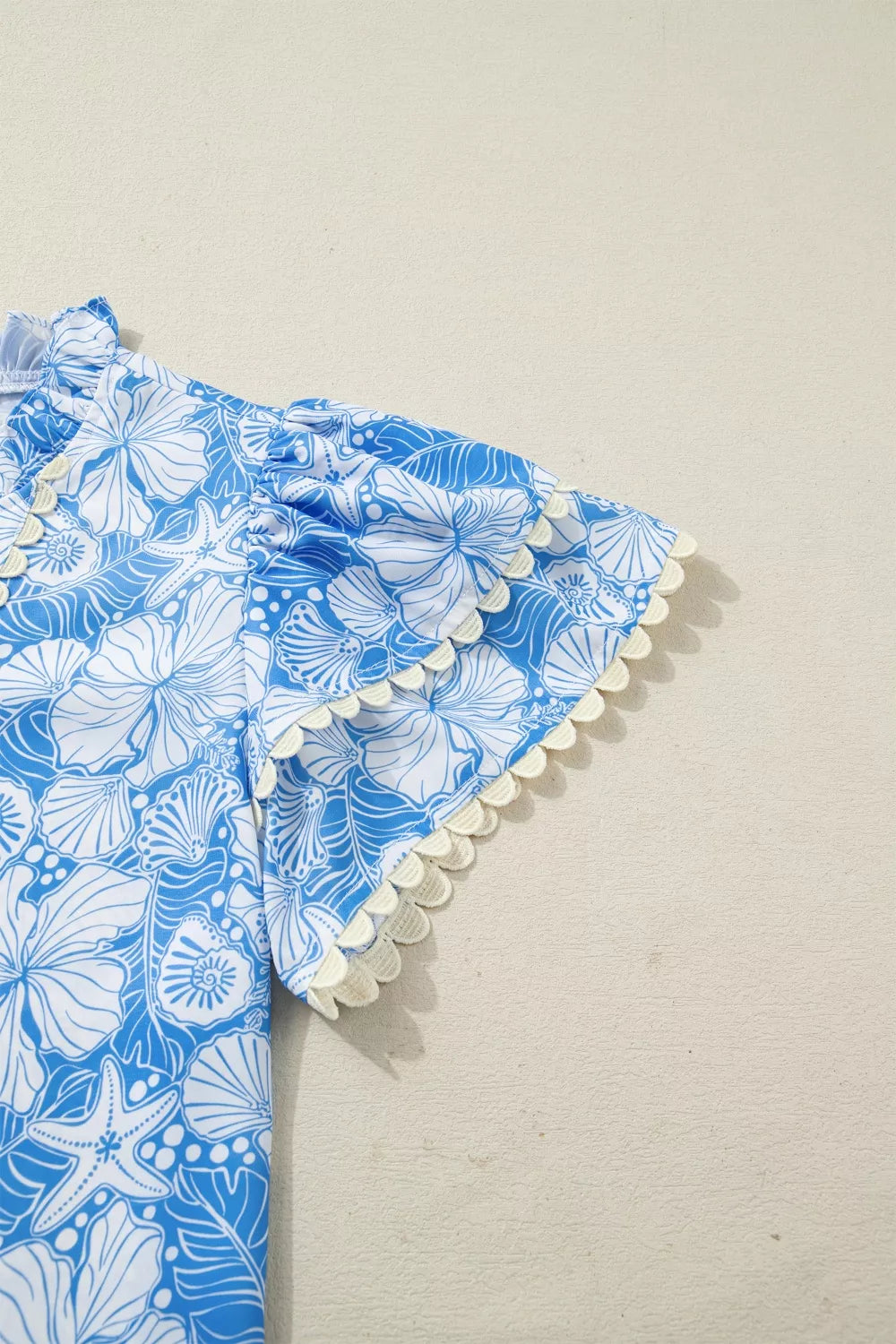 Light blue floral scalloped trim v neck blouse full length view