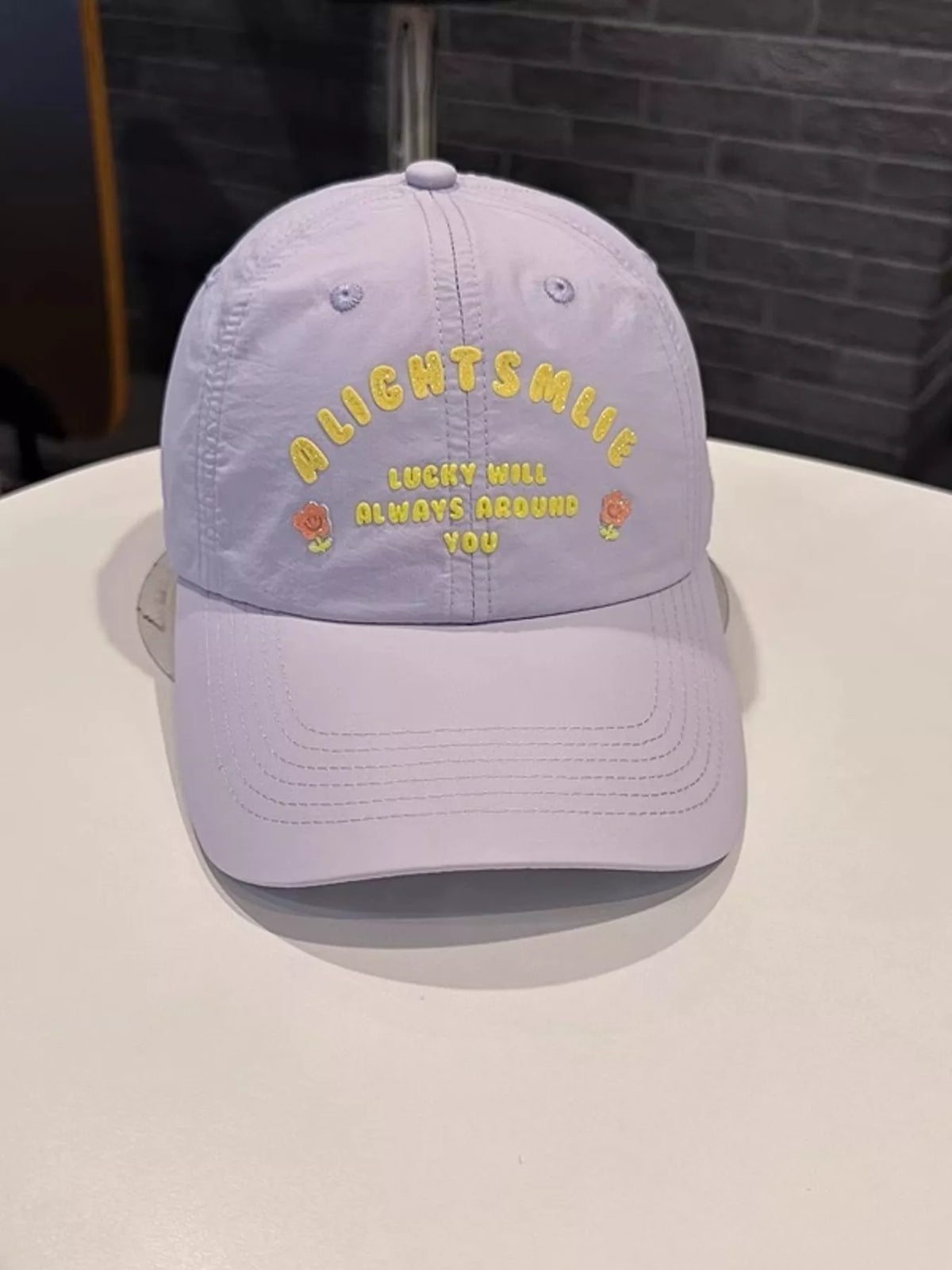 Embroidered cap in a bright colorway, three quarter view
