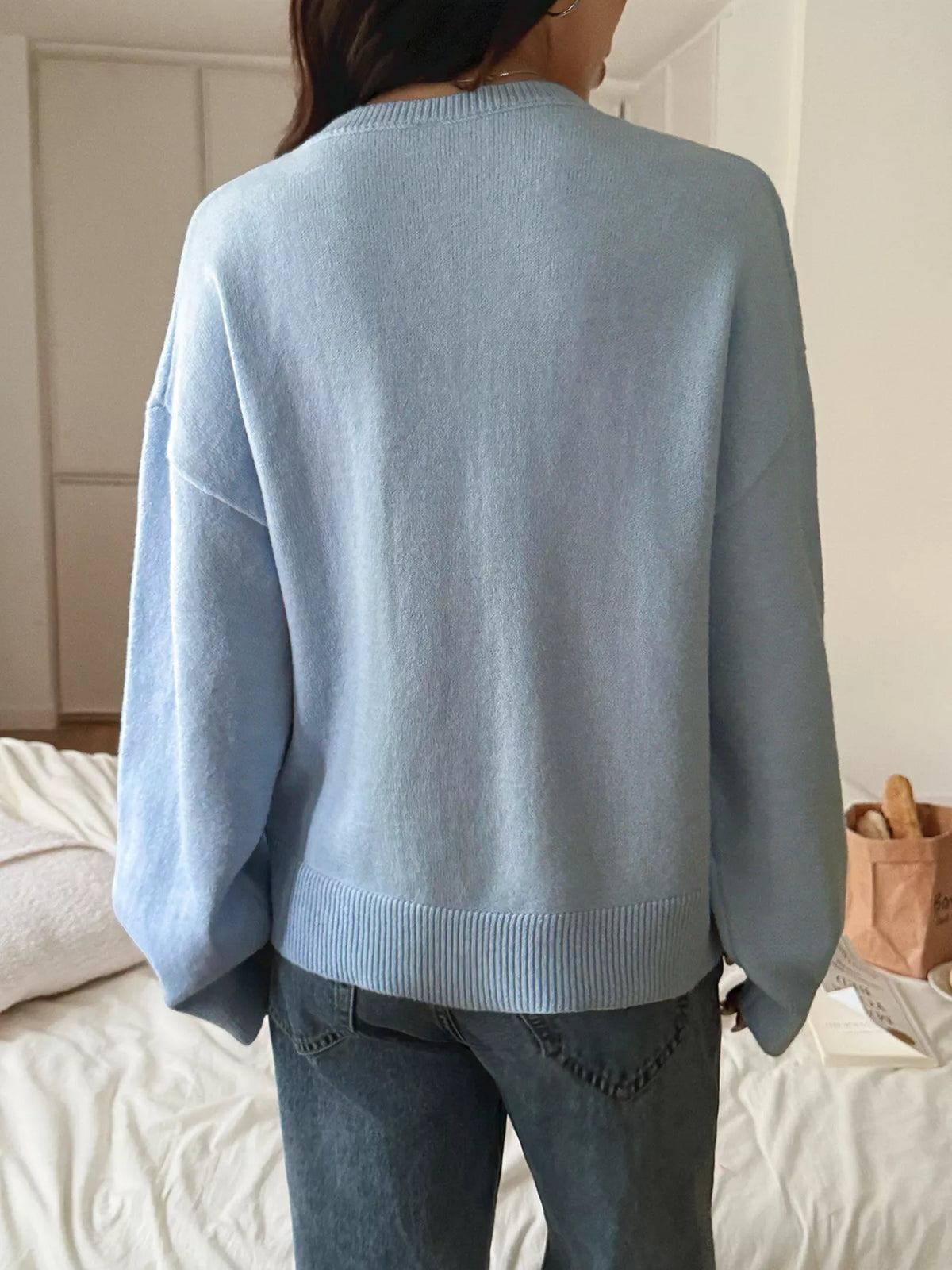 Pastel V neck pullover sweater styled with jeans