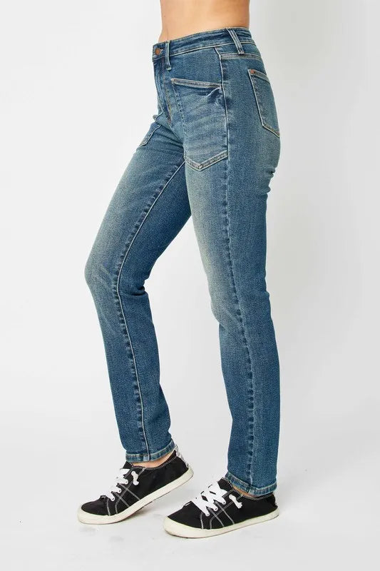 Back view of dark wash skinny jeans with pockets