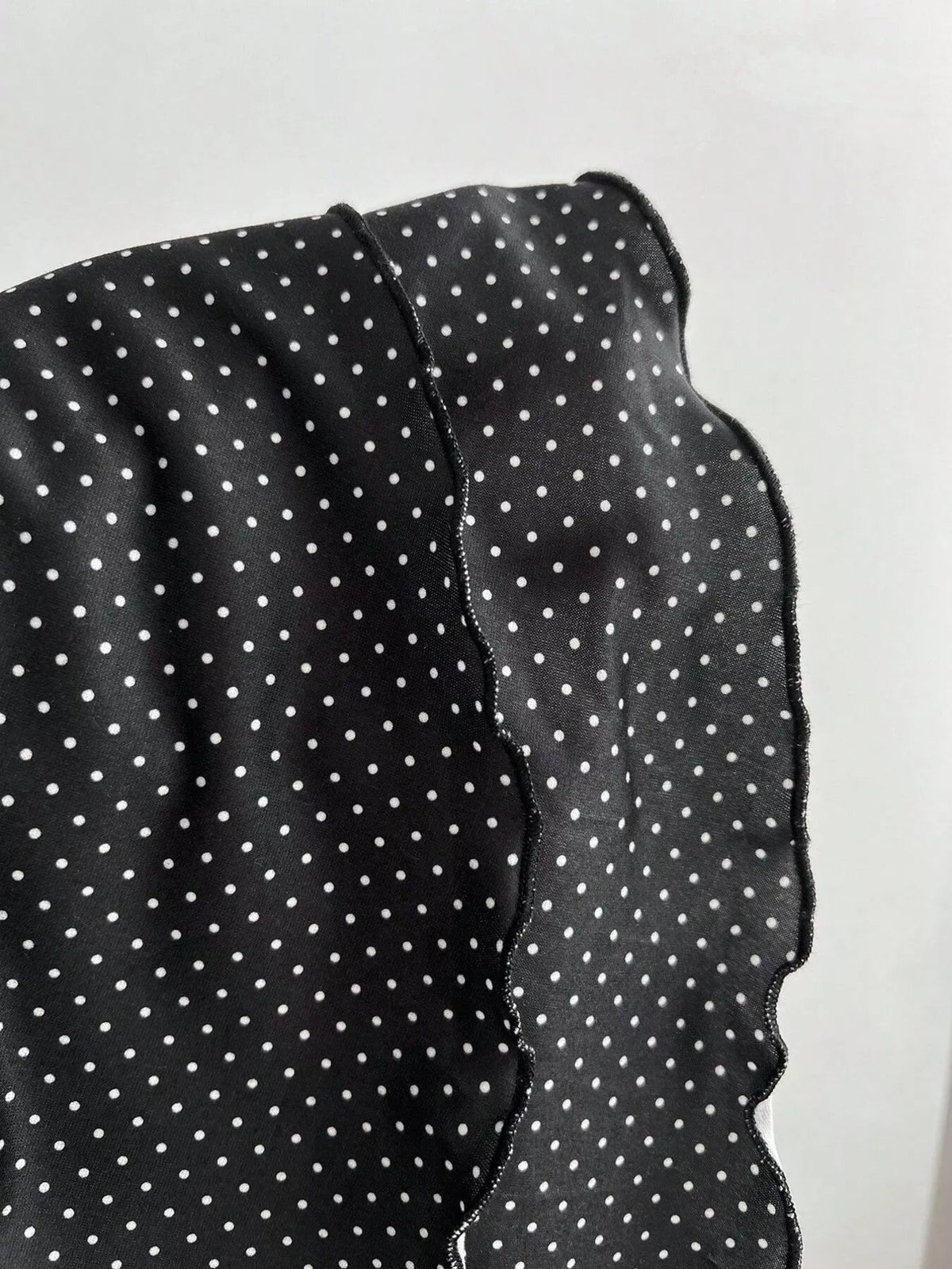 Black polka dot halter mini dress full length view