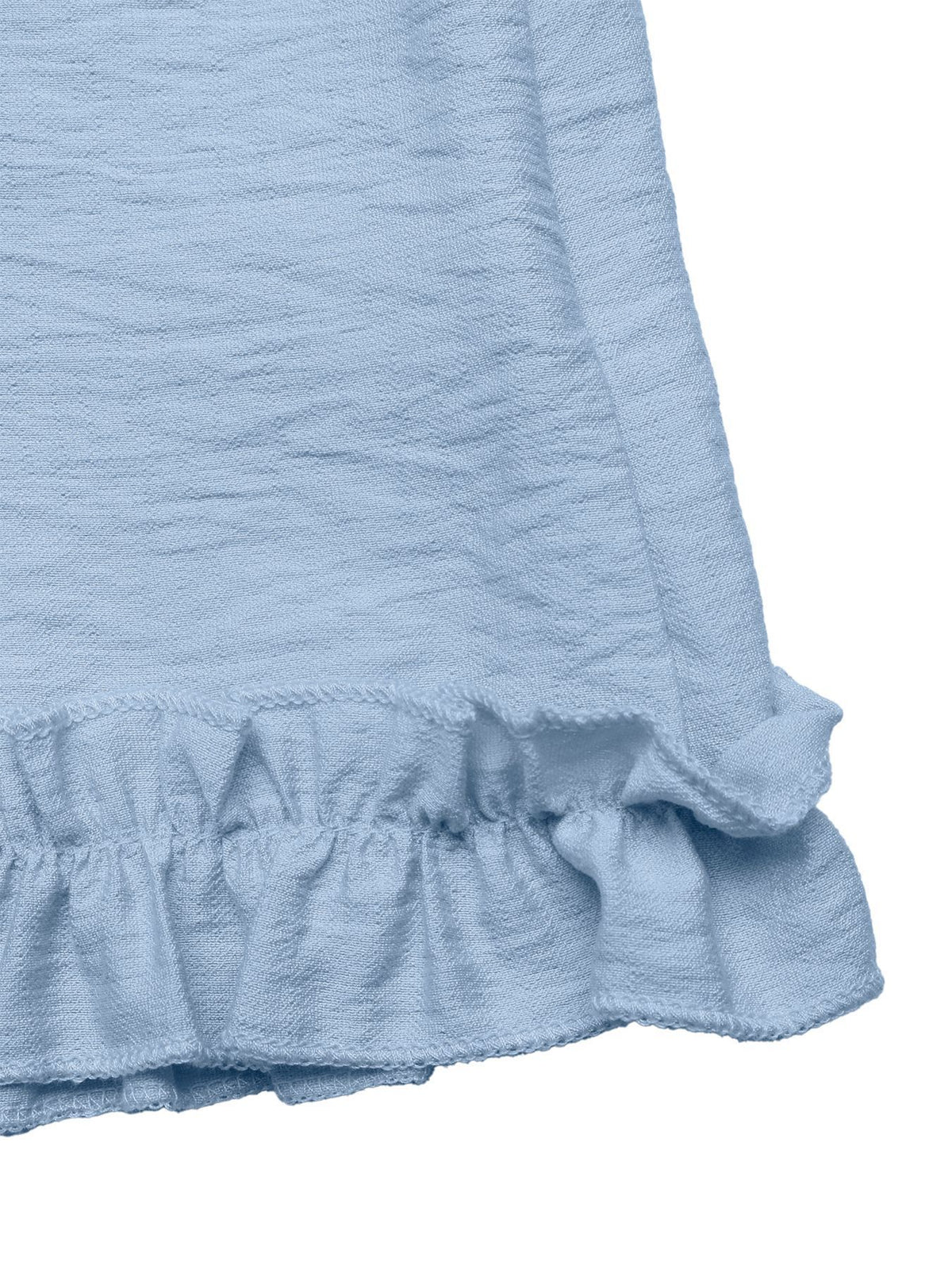 Three quarter view of the ruffle hem romper
