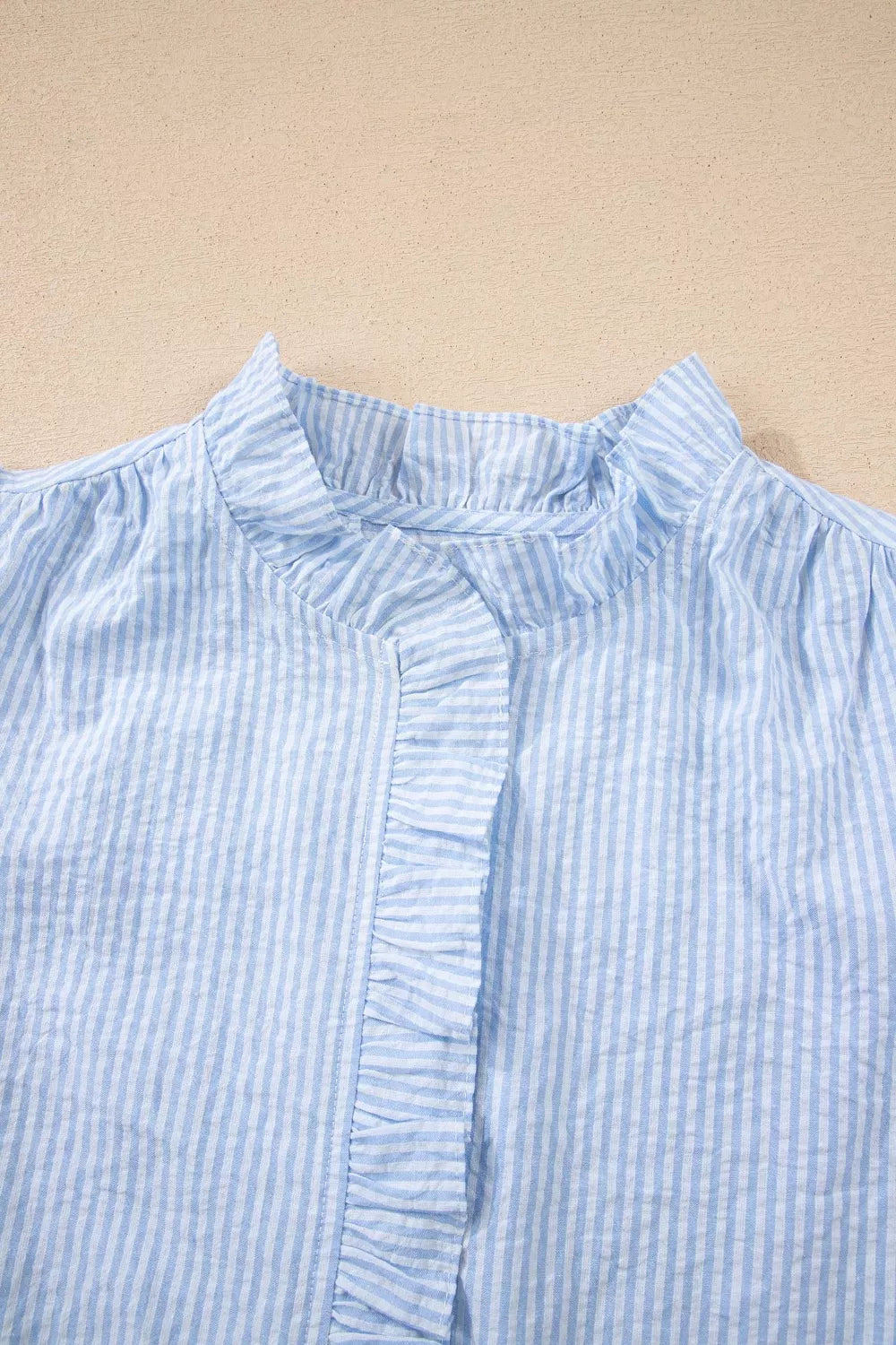 Light blue striped floral embroidered puff sleeve shirt side view
