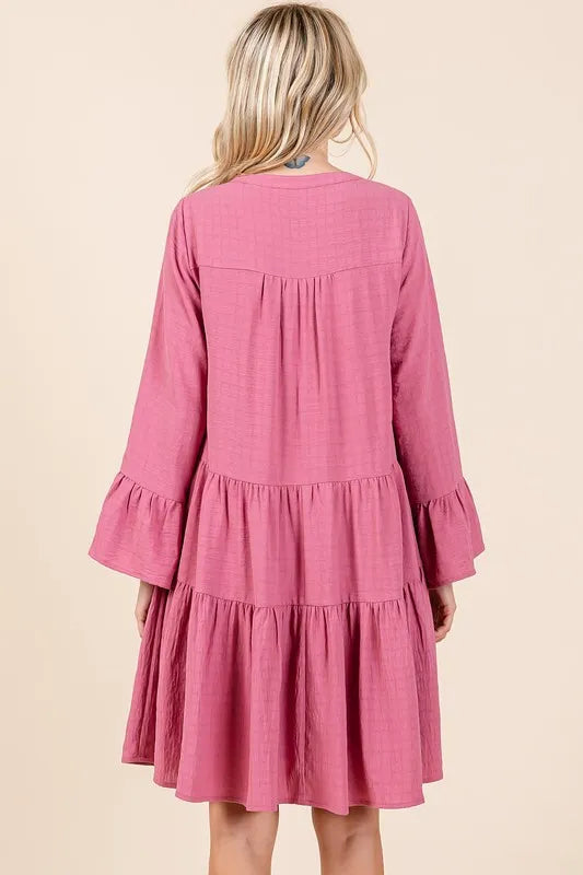 Rose pink dress showing flare sleeve detail