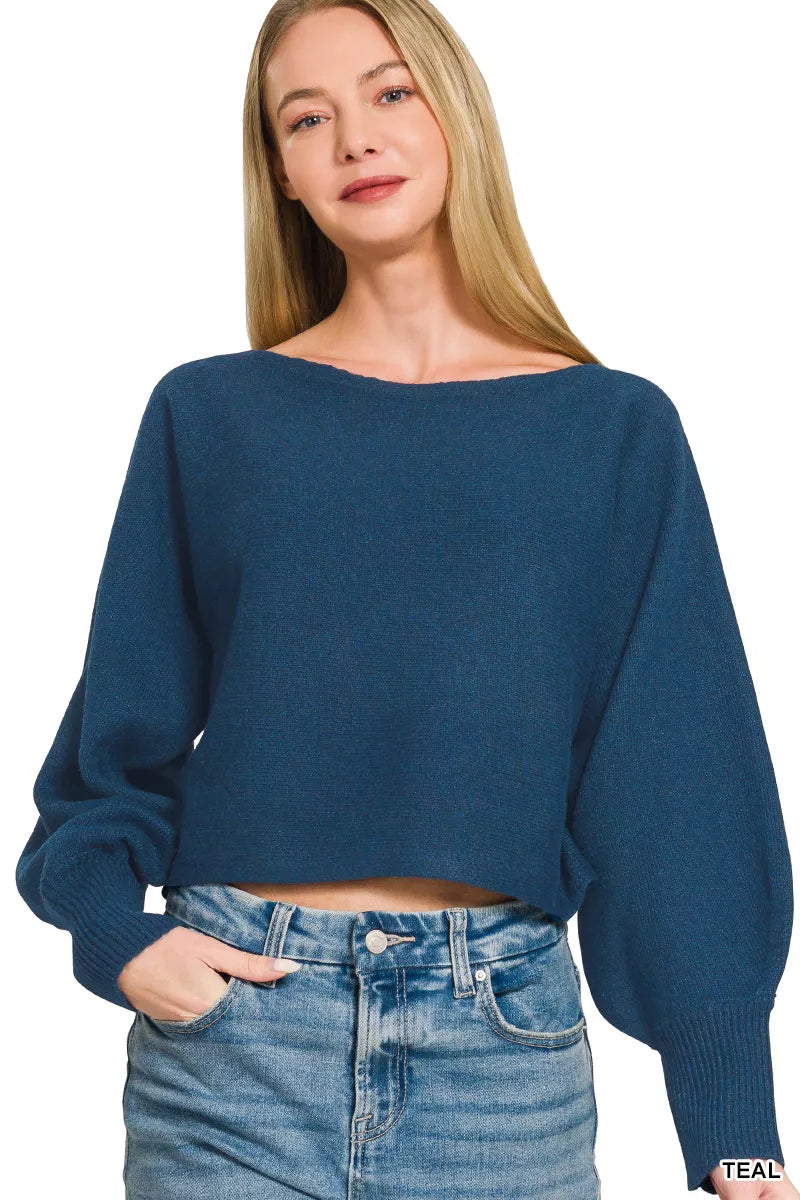 Model wearing teal balloon sleeve sweater