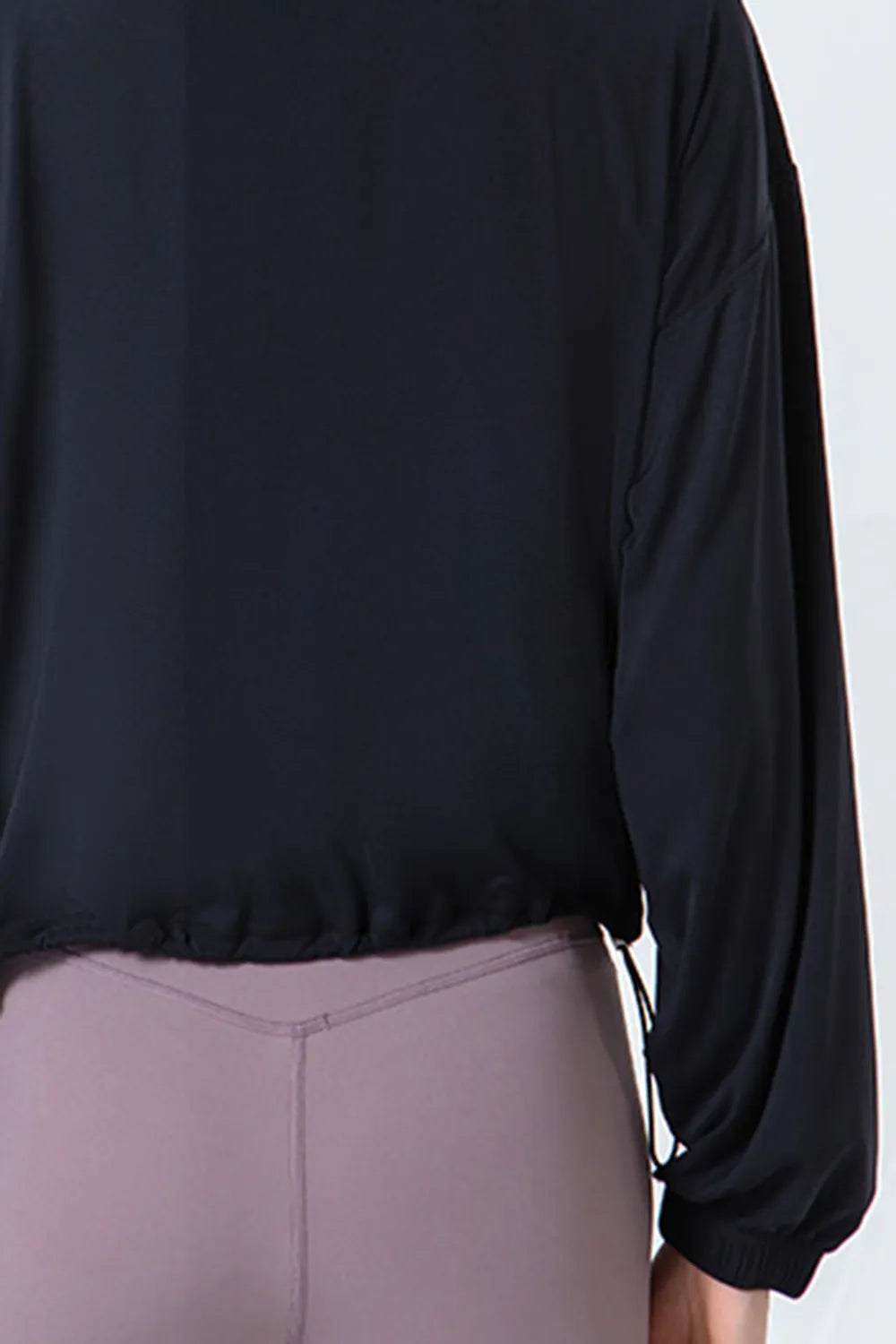 Drawstring zip up dropped shoulder active jacket close up detail