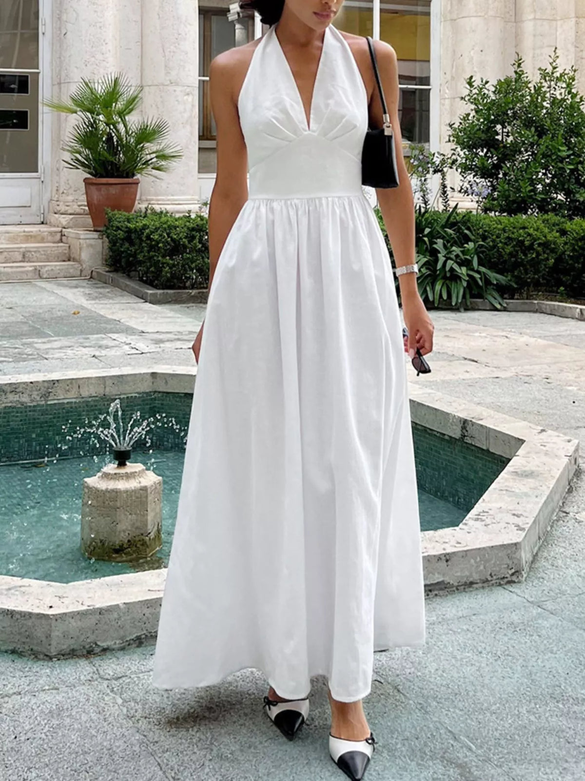 white halter neck tied flowy maxi dress side view