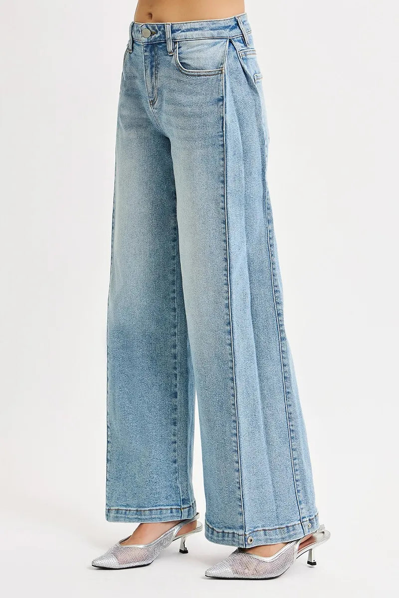 Model wearing RISEN wide barrel jeans full length look